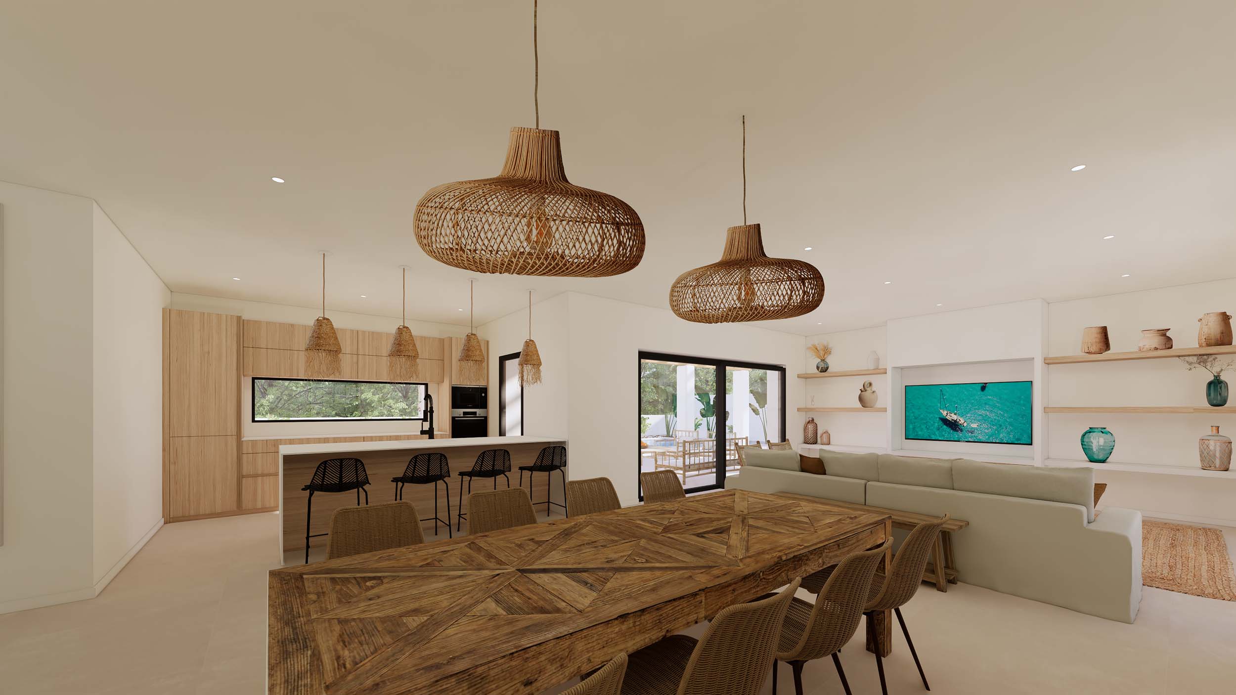 Salón-comedor diáfano con mesa de madera geométrica, cocina integrada con isla y lámparas de mimbre, conectado al exterior mediante grandes ventanales.