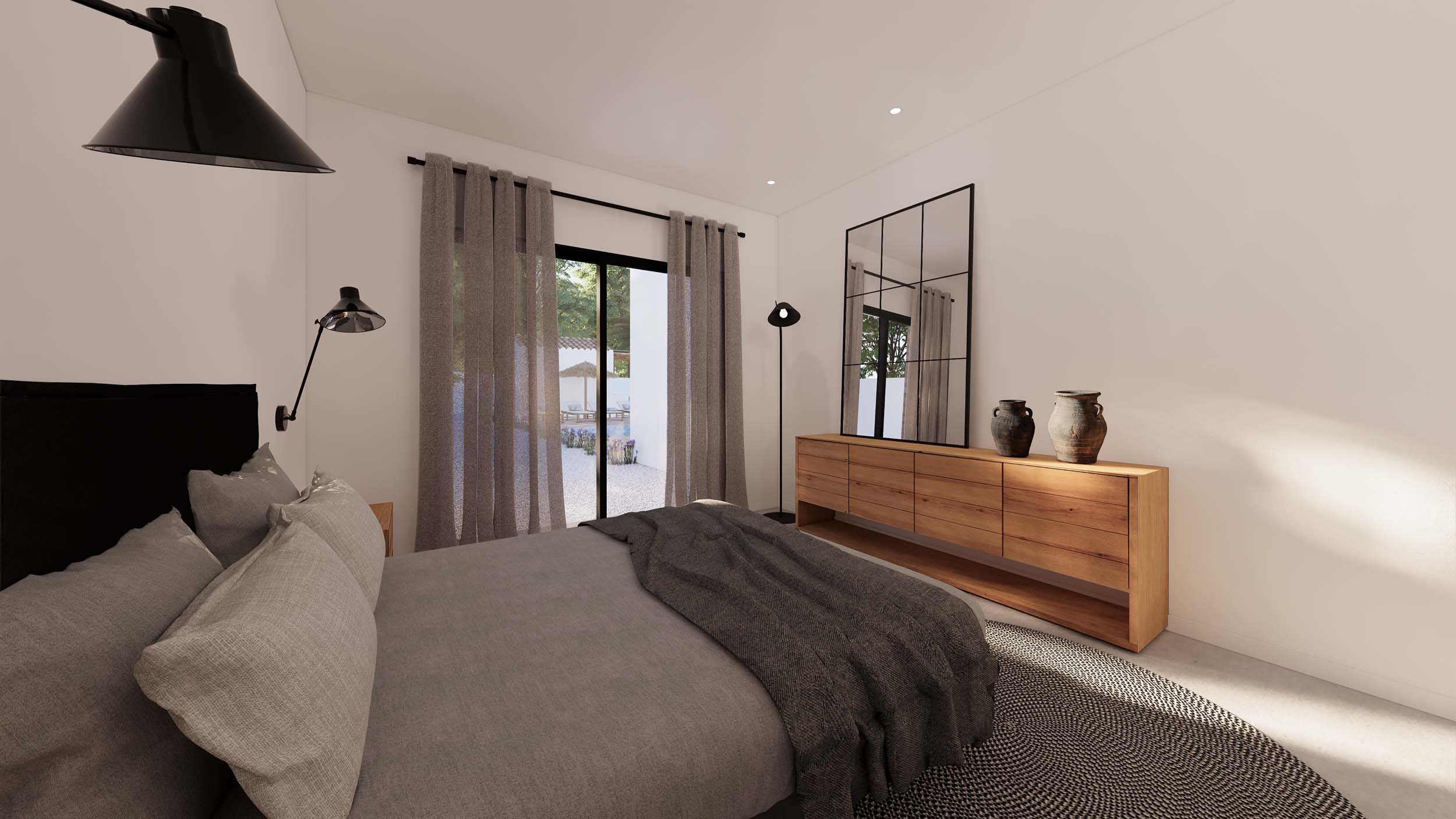 Dormitorio con aparador de madera natural, espejo de estilo industrial y acceso directo al jardín a través de ventanales con cortinas de lino.