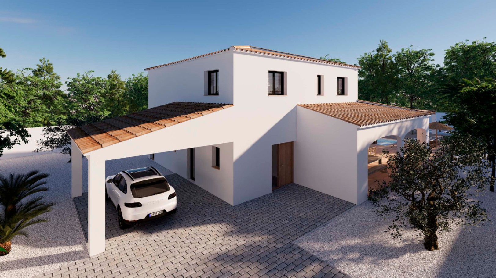 Vista exterior de la villa con fachada blanca, tejado de teja cerámica y zona de aparcamiento cubierta sobre pavimento de adoquines grises.