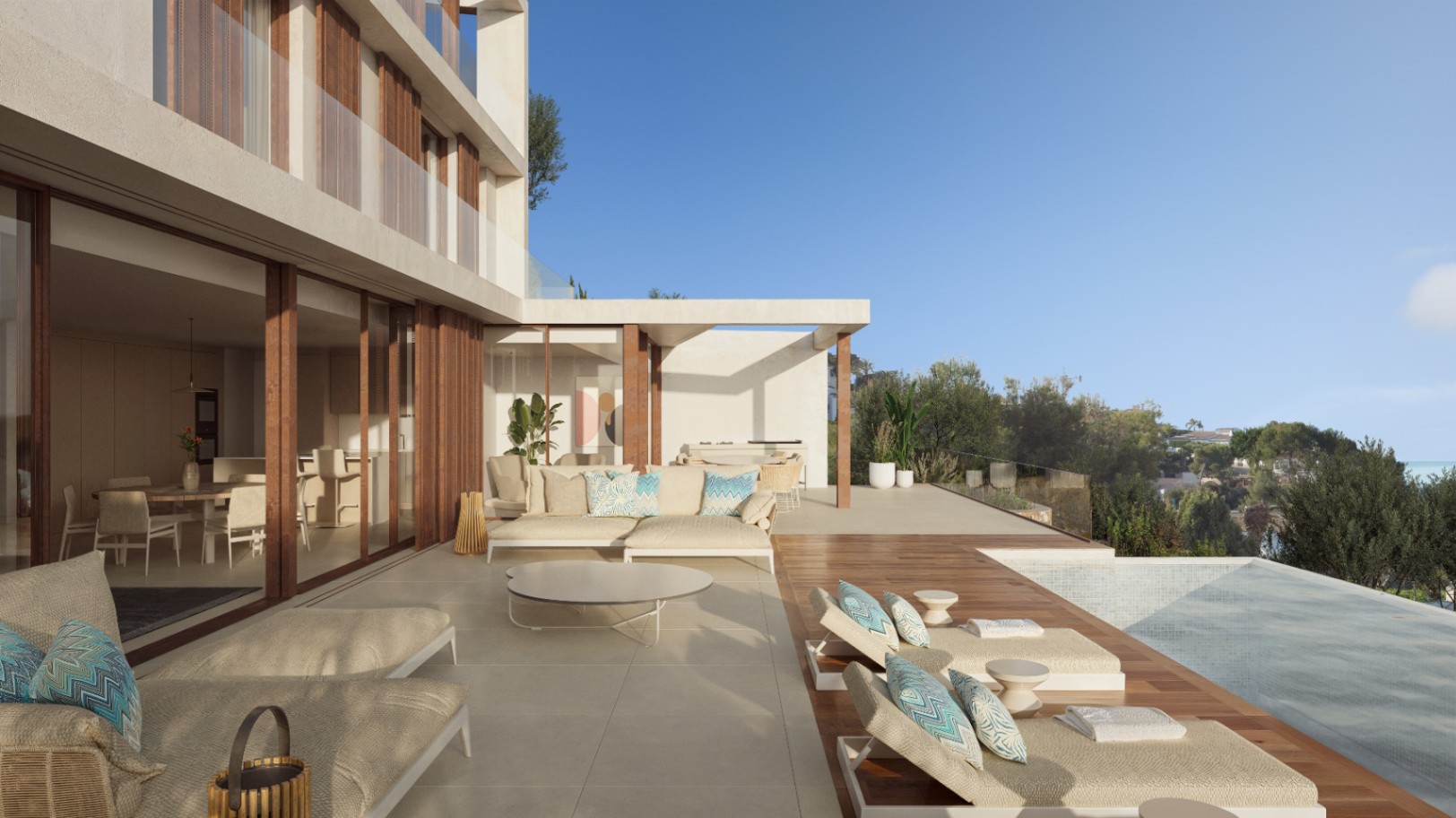 Terraza principal con zona de estar, tumbonas sobre tarima de madera y piscina infinita. Grandes ventanales conectan el interior con el exterior bajo una fachada de estilo ibicenco.