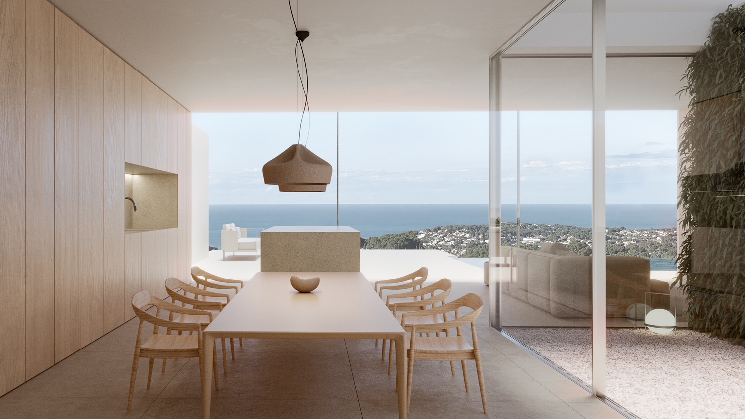 Comedor minimalista con mesa de madera clara y vistas panorámicas al mar, iluminación colgante moderna.