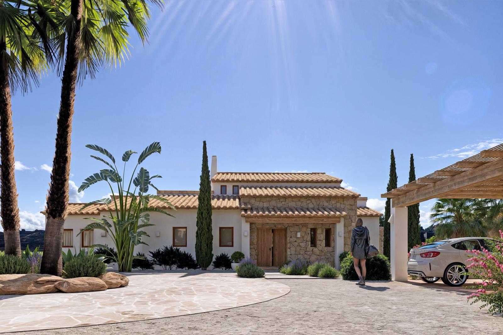 Fachada principal de estilo rústico con muros de piedra natural, tejado de teja árabe y zona de aparcamiento exterior bajo pérgola de madera, rodeada de vegetación mediterránea.