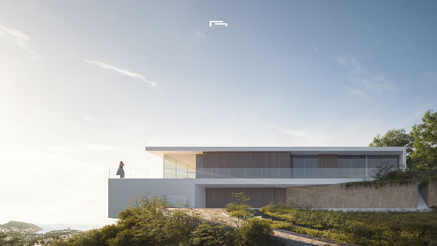 Vista exterior de la villa moderna con fachada blanca, paneles de madera y muros de piedra. Destaca la terraza voladiza con barandillas de cristal y vistas despejadas hacia el mar.