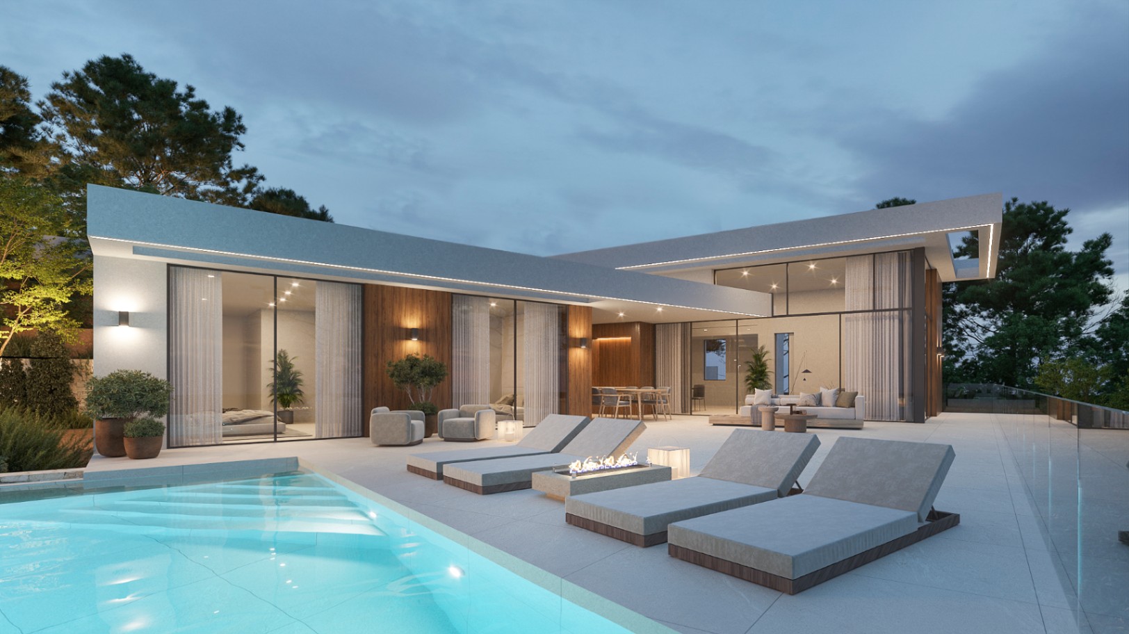 Exterior de villa moderna al atardecer con terraza de gres, piscina iluminada, zona de tumbonas con brasero y fachada de madera con grandes ventanales.