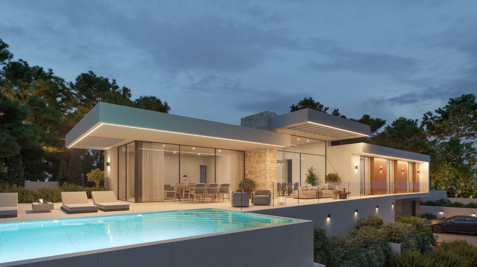 Vista nocturna de la villa con piscina infinita, amplias terrazas con iluminación LED integrada y fachada de piedra natural con grandes ventanales.
