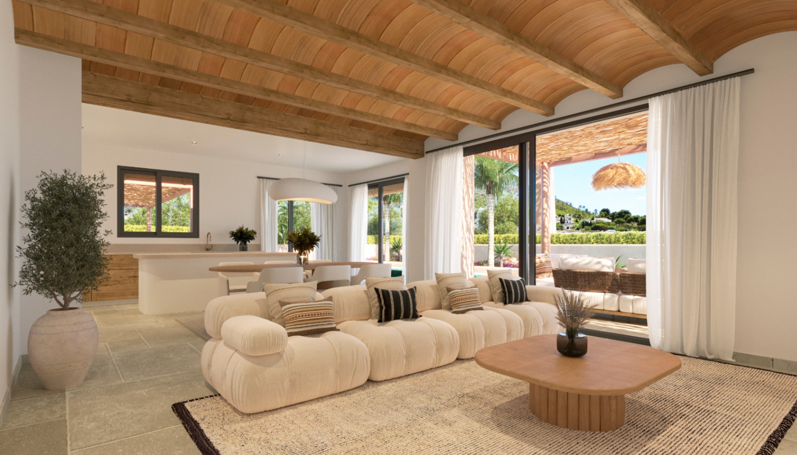 Salón de planta abierta con techos de bóveda catalana y vigas de madera, conectado a una terraza exterior mediante grandes ventanales que inundan el espacio de luz natural.