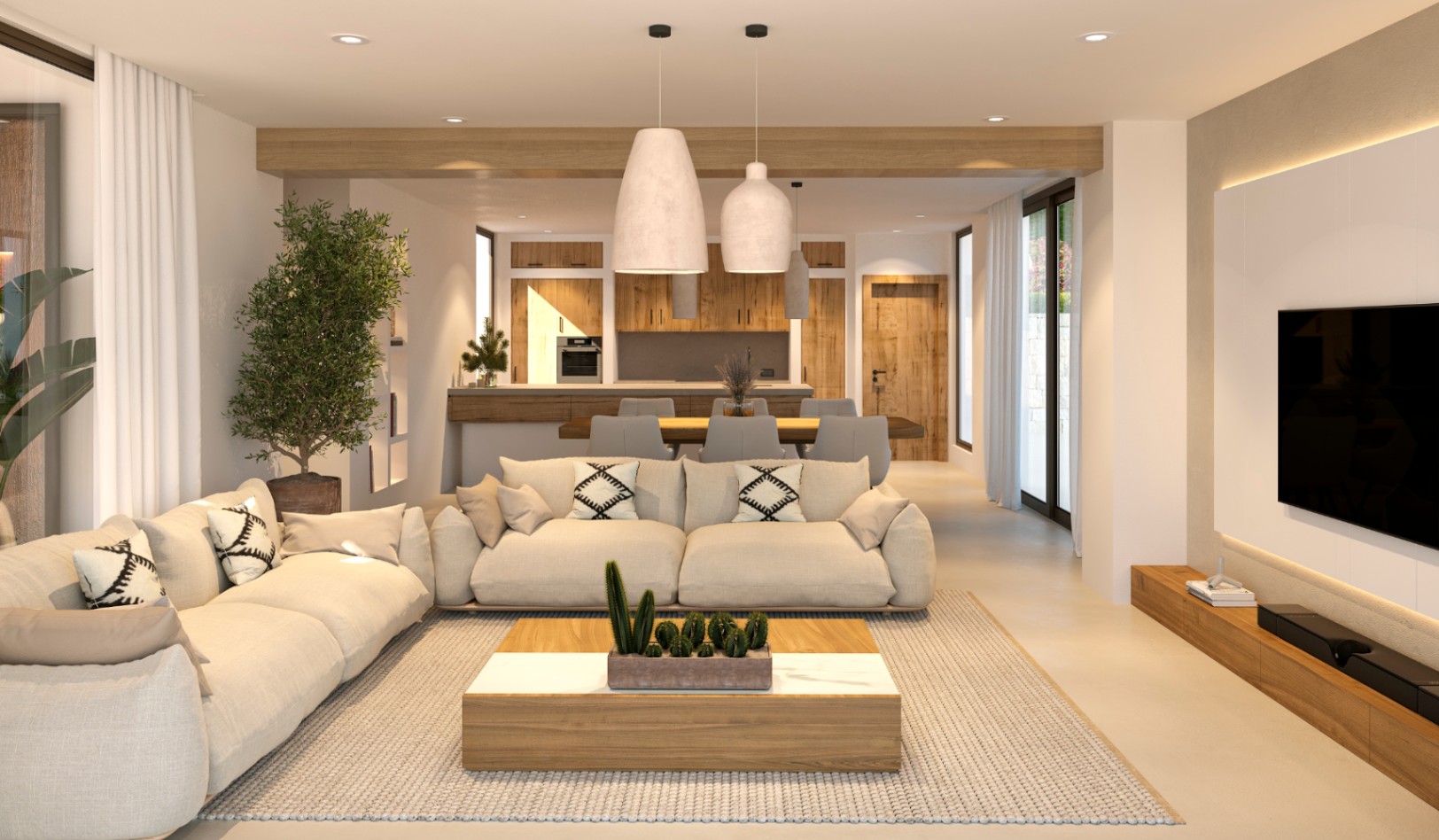Salón diáfano de estilo ibicenco con vigas de madera, sofás en tonos neutros y zona de comedor integrada que conecta con una cocina de diseño en madera.