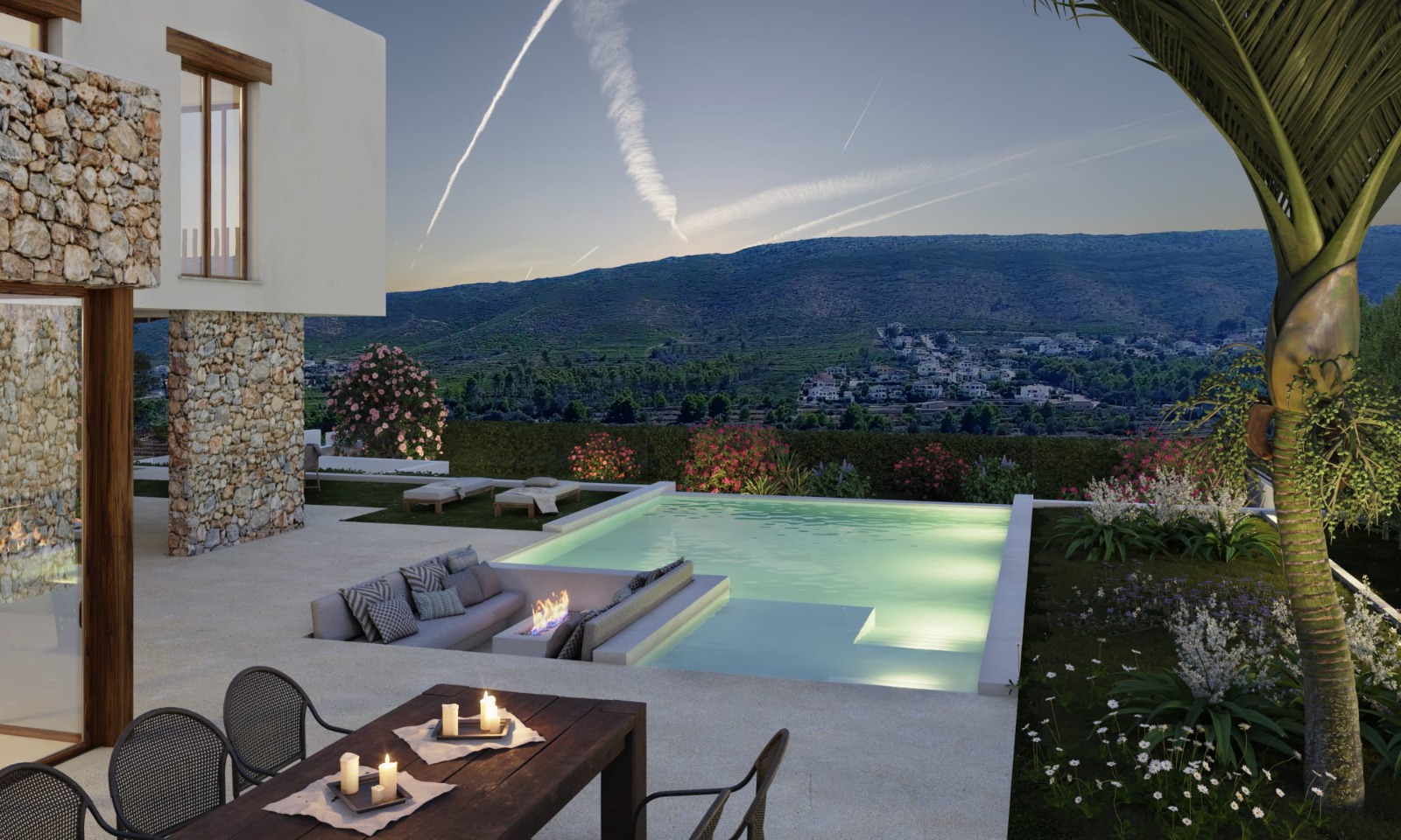 Terraza exterior con piscina infinita que integra una zona de estar hundida con brasero. Fachada de piedra natural y vistas panorámicas al valle de Jávea al atardecer.