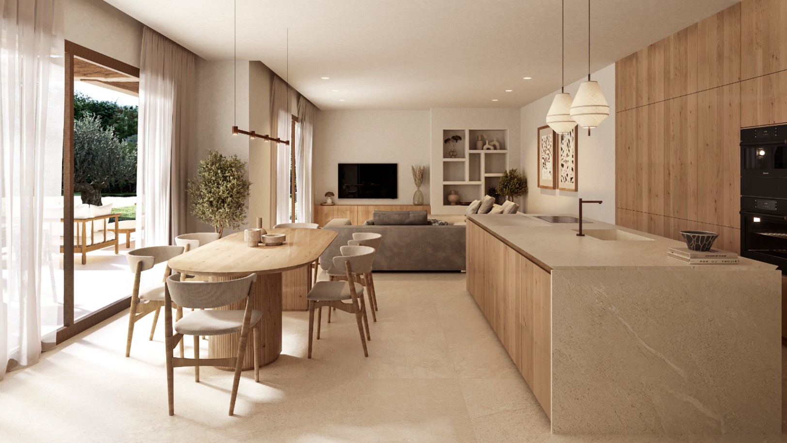Salón-comedor diáfano con cocina integrada, isla de piedra, mesa de madera ovalada y acceso directo a la terraza con vistas al jardín mediterráneo.