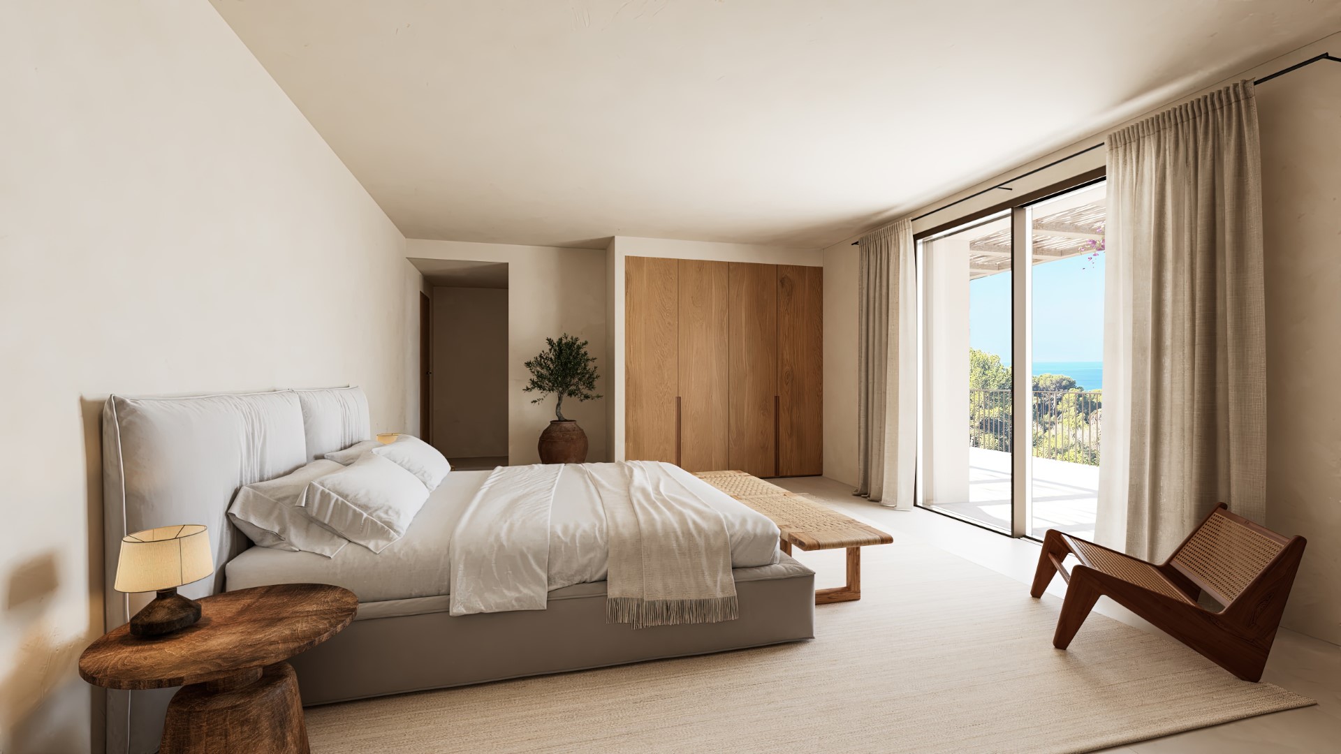 Dormitorio principal con armarios de roble integrados, mobiliario de madera natural y ventanales correderos con acceso a la terraza y vistas al mar.