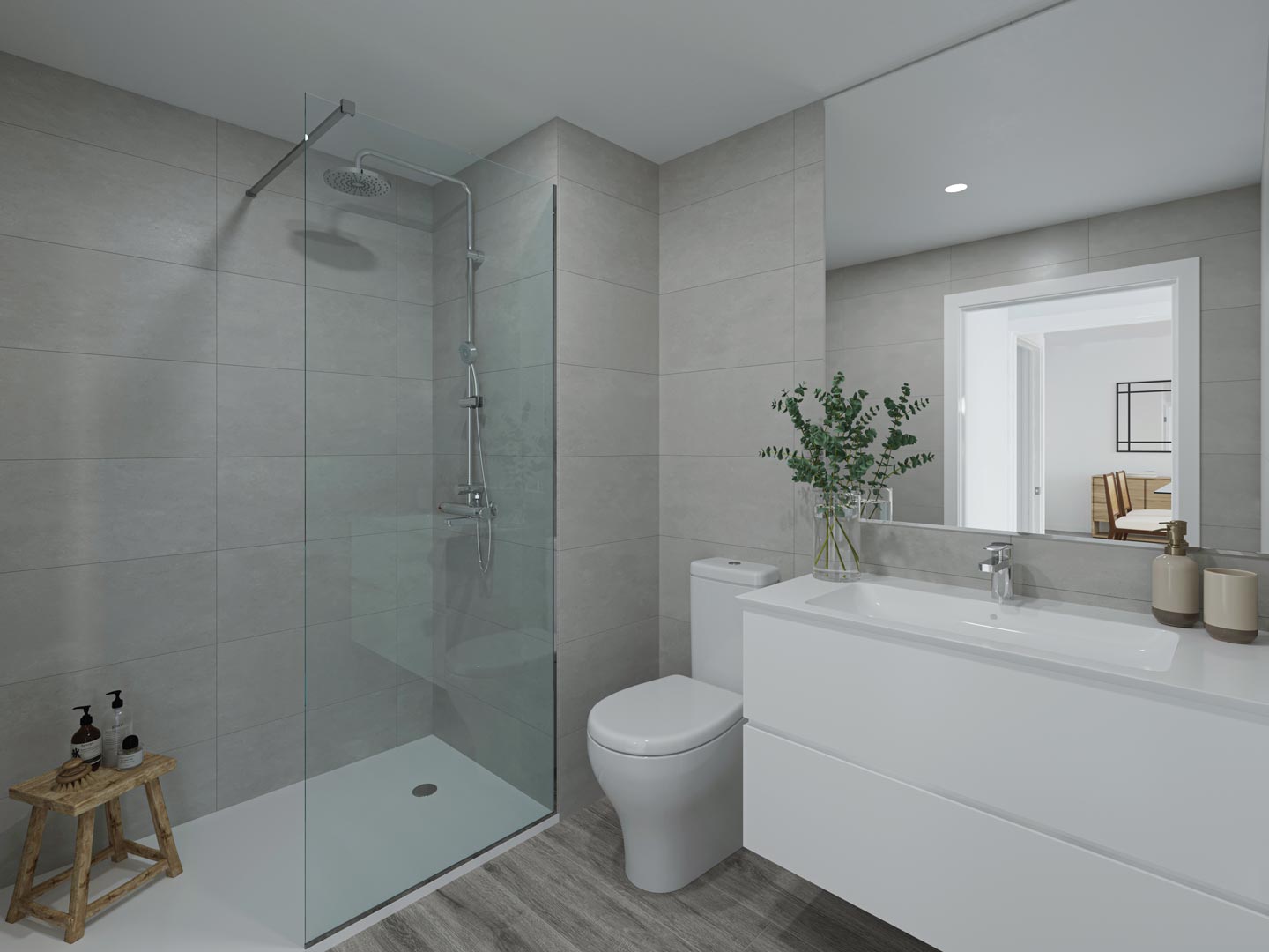 Baño moderno con ducha a ras de suelo, mampara de cristal, azulejos grises de gran formato, mueble de lavabo suspendido blanco y suelos cerámicos de efecto madera.