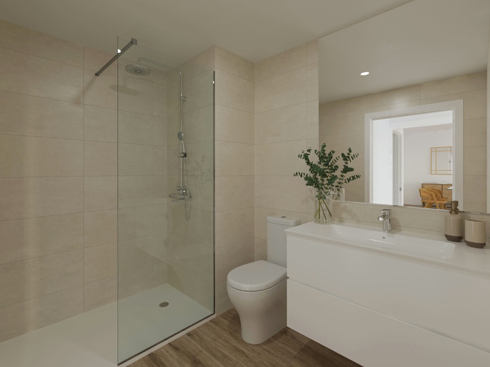 Baño moderno con ducha a ras de suelo, mampara de cristal, azulejos en tonos arena y mueble de lavabo suspendido en blanco.