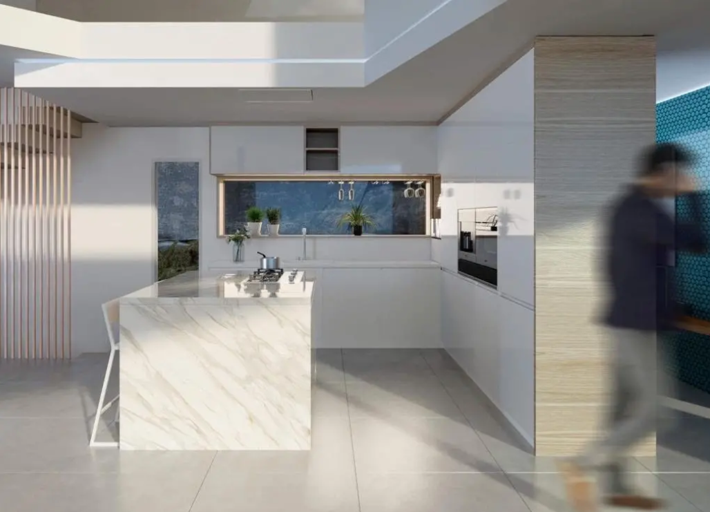 Cocina de diseño con isla de mármol veteado, placa de gas integrada y mobiliario minimalista blanco. Incluye un ventanal panorámico frontal y acabados en madera natural.