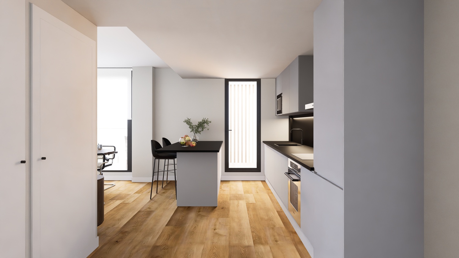 Cocina moderna de concepto abierto con mobiliario gris, encimeras negras e isla central. El suelo de madera clara aporta calidez a este espacio minimalista y luminoso.