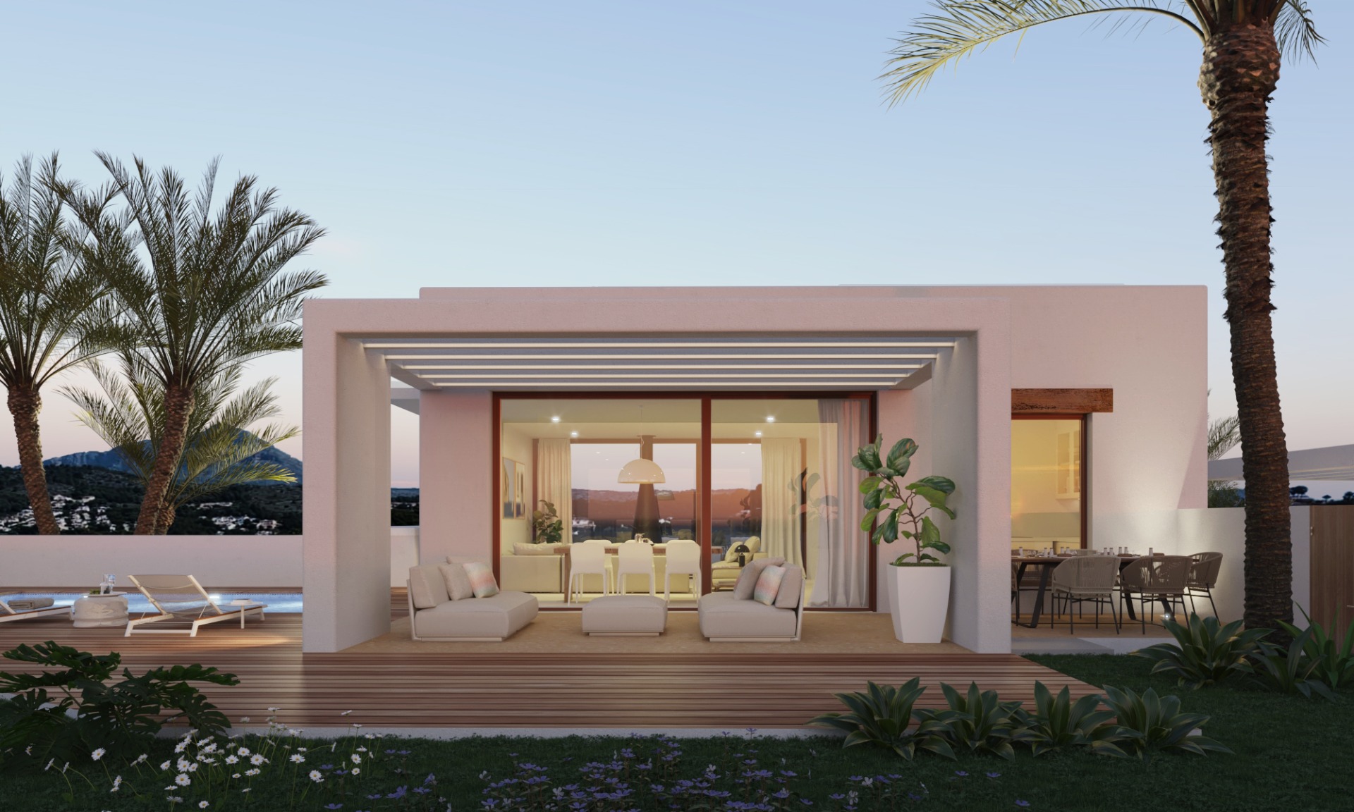 Exterior de la villa con terraza cubierta, tarima de madera, comedor al aire libre y vistas panorámicas al Montgó integradas en el paisaje mediterráneo.