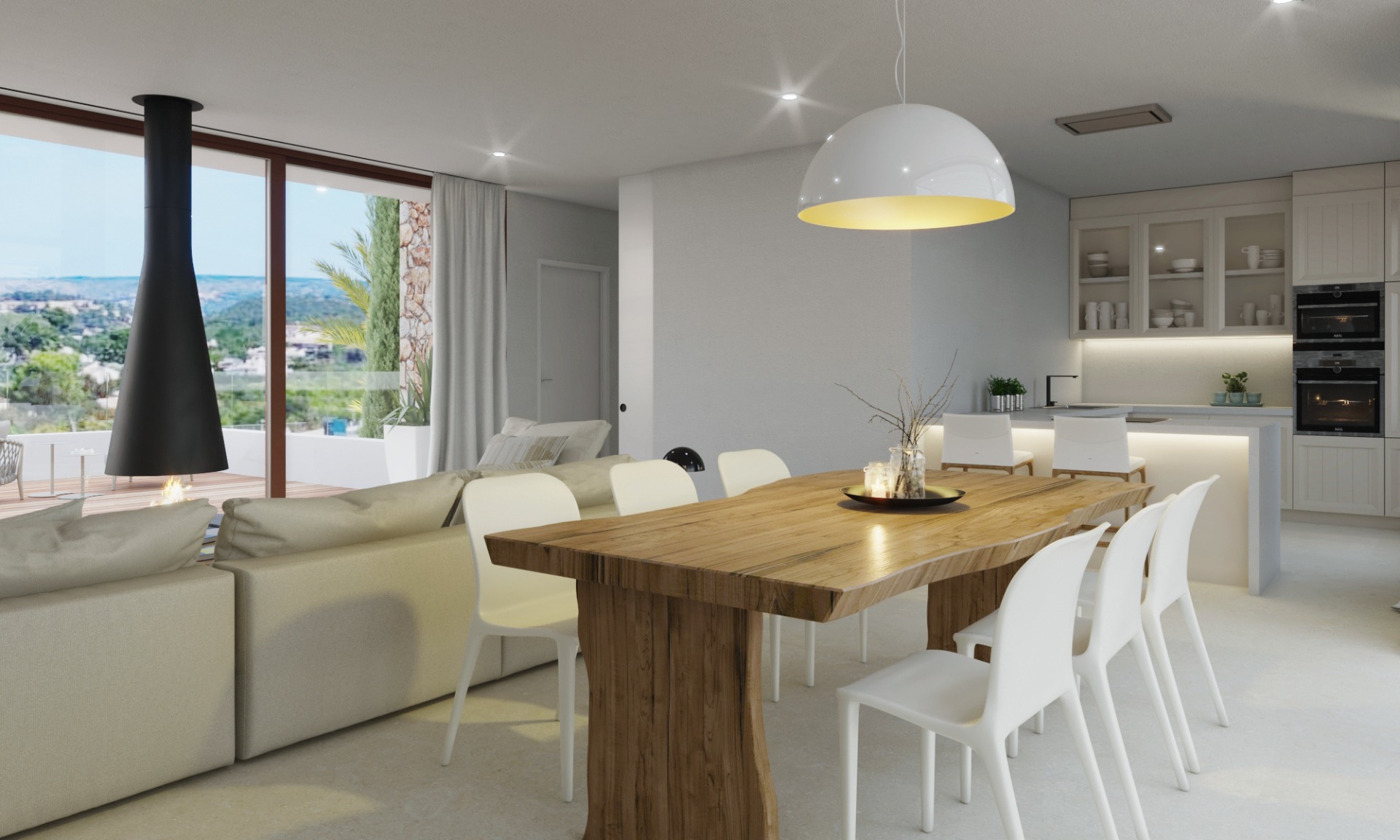 Zona de día de planta abierta con mesa de comedor de madera maciza, cocina moderna integrada y chimenea suspendida con vistas panorámicas al valle.