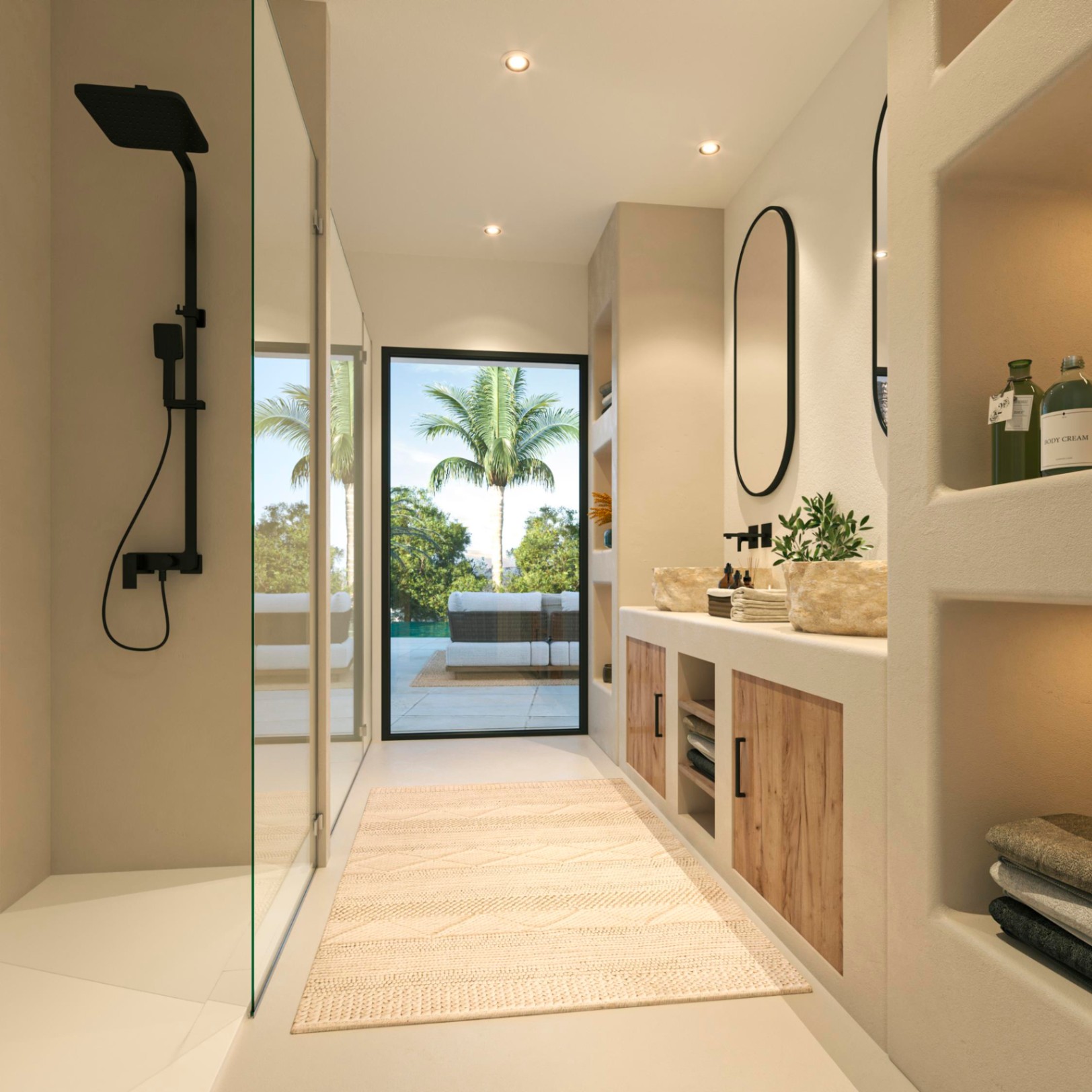 Baño de diseño con lavabos de piedra, grifería negra y ducha italiana. Destaca el acceso directo a la terraza mediante un gran ventanal que aporta abundante luz natural.
