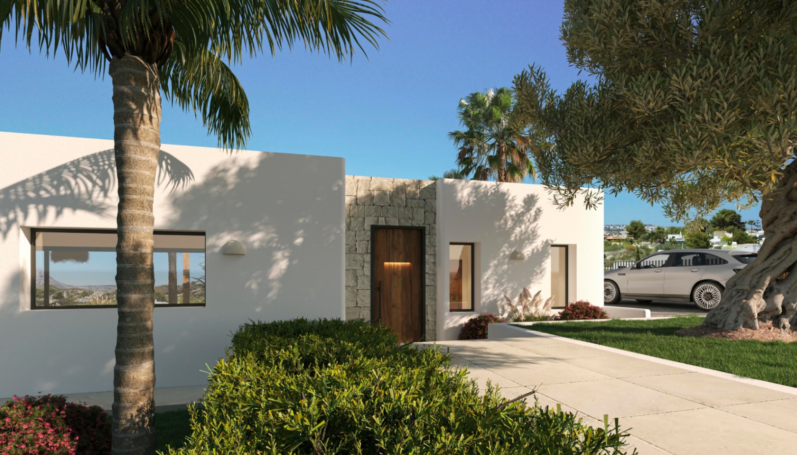 Fachada moderna con muros de revoco blanco y detalles en piedra natural. La entrada de madera oscura se integra en un jardín mediterráneo con palmeras y olivos centenarios.