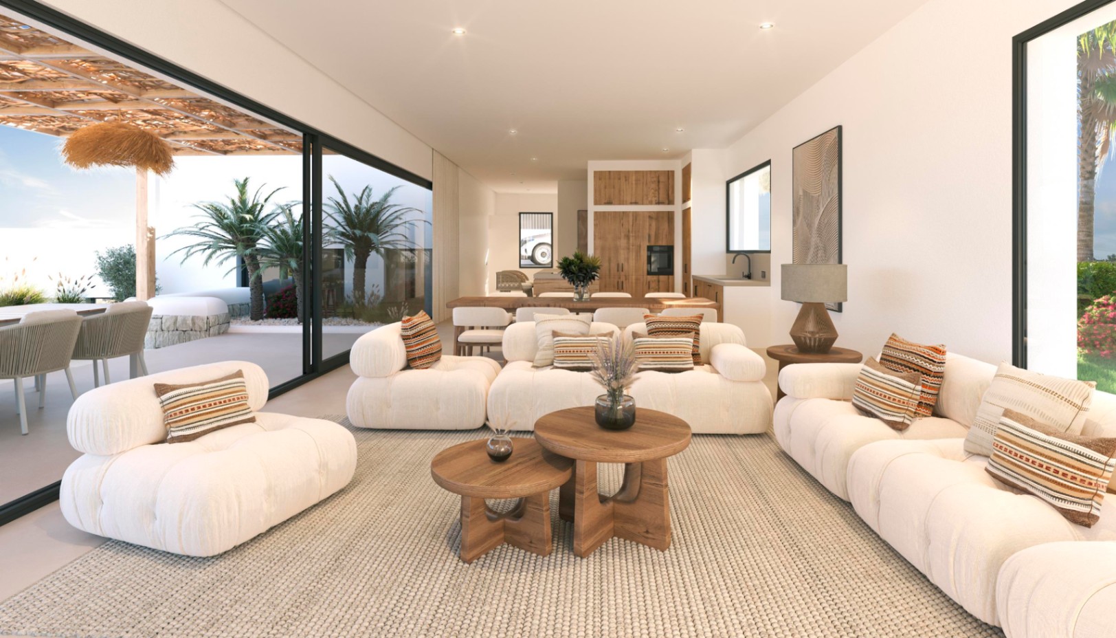 Salón de concepto abierto con sofás modulares blancos, mesas de centro de madera y grandes ventanales que conectan con la terraza exterior y el jardín.