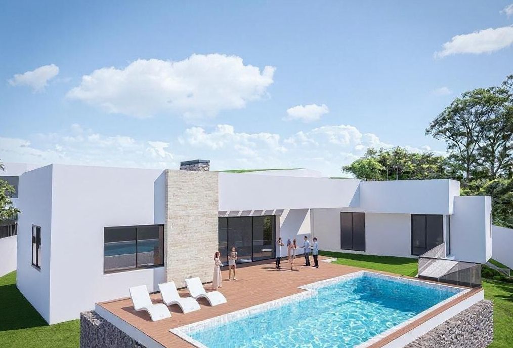 Exterior de villa moderna con fachada blanca, detalles en piedra natural, amplia terraza de madera y piscina rectangular integrada en el jardín.