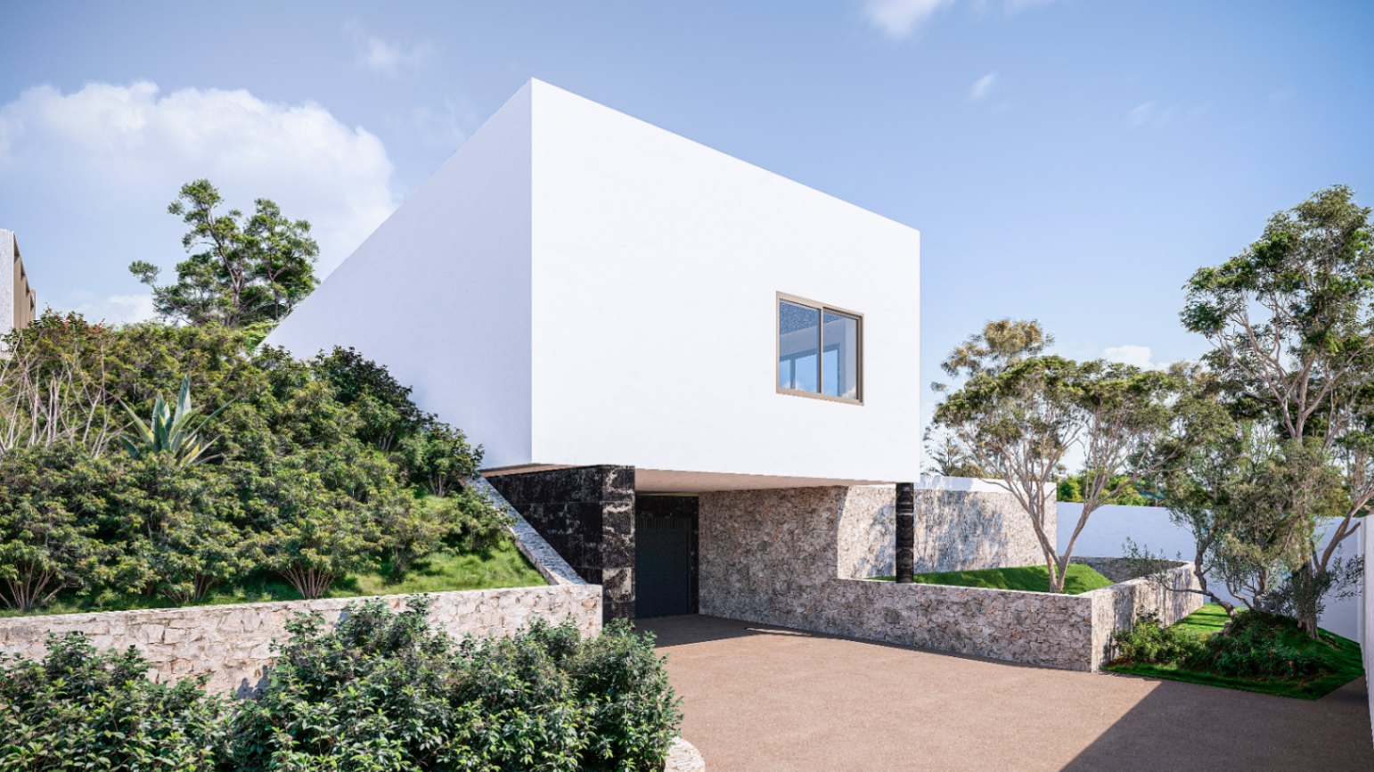 Fachada minimalista con un volumen superior blanco volado sobre muros de piedra natural y acceso al garaje, rodeado de vegetación mediterránea autóctona.